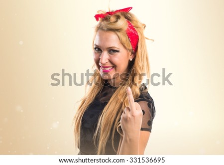 Woman making horn gesture
