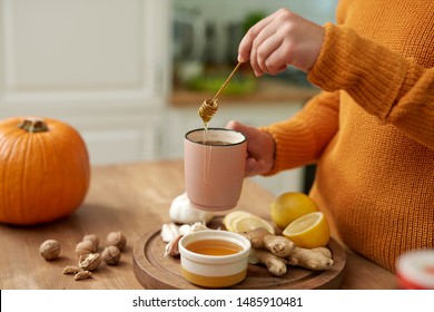 Woman Making Hot Tea With Honey 