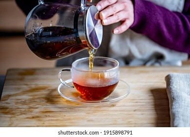 Woman Is Making Hot Tea In The Kitchen.
