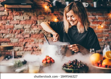Woman making ice cream with liquid nitrogen.
