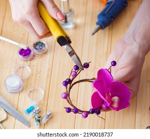 Woman Making Jewelry At Home