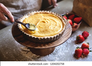 Woman making lemon meringue tart - Powered by Shutterstock