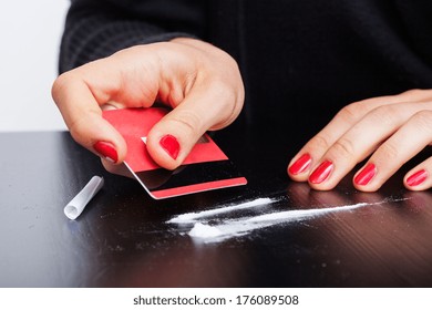 Woman Making Lines Of Cocaine With A Credit Card