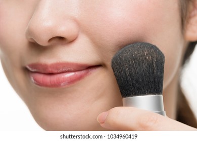 
Woman making up makeup, foundation, brush