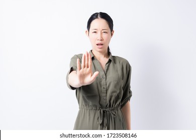 A Woman Making An NG Sign