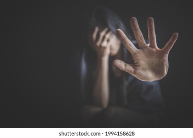 woman making NO or STOP gesture with hand, Stop drugs, Stop violence against children, stop violence against women, human rights violations, human trafficking
