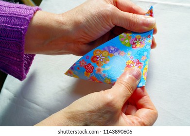 A Woman Making Origami.