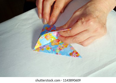 A Woman Making Origami.