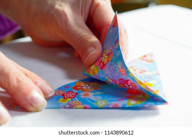 A Woman Making Origami.