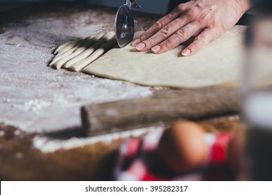 Woman Making Pasta From Dough