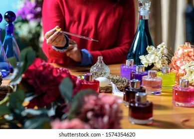 Woman Making Perfume With Test Tubes In Craft Workshop 