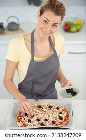 Woman Making Pizza At Home