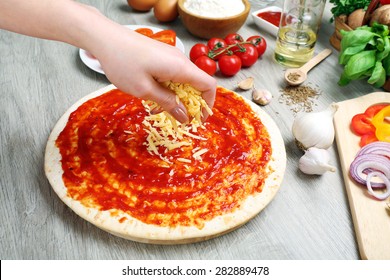 Woman Making Pizza On Table Close Up