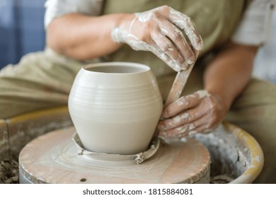 Woman Making Pottery On The Wheel