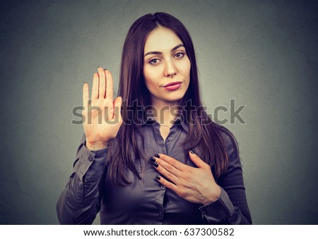 Woman making a promise or testifies  