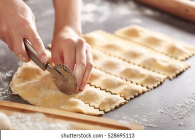 Woman Making Ravioli On Table