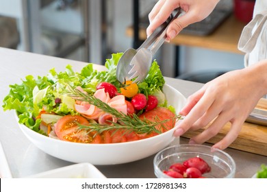 Woman Making A Salad In The Kitchen