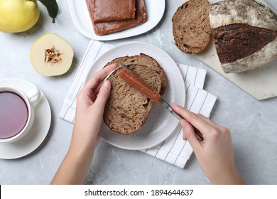 Woman Making Sandwich With Quince Paste At Table, Top View