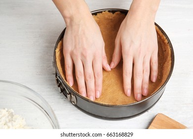 Woman Making Tasty Cheesecake On Kitchen