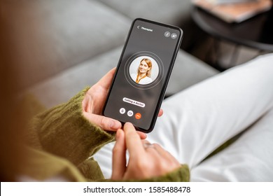Woman making video call to a doctor using digital tablet, feeling bad at home. Concept of telemedicine and patient counseling online - Shutterstock ID 1585488478