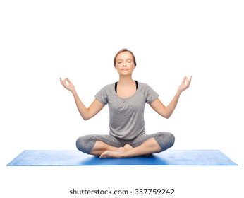 Woman Making Yoga Meditation In Lotus Pose On Mat