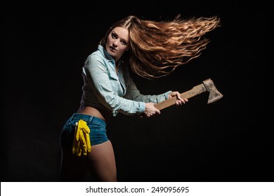 Woman In Male Specialities. Feminist Sexy Woman With Tools Hatchet. Blowing Hair On Black Grey Background In Studio.