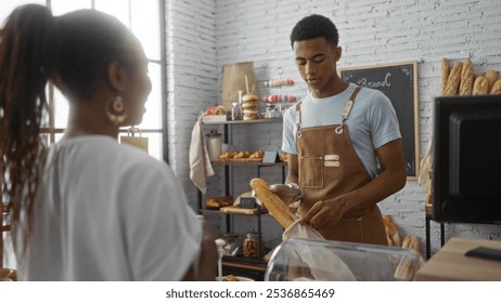 Woman and man in bakery, worker serving bread to customer in cozy shop interior - Powered by Shutterstock