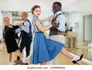 Woman And Man Dancing Swing In Studio