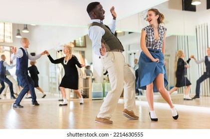 Woman And Man Dancing Swing In Studio