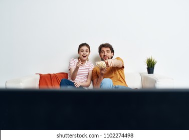  woman man emotions young couple watching television                              