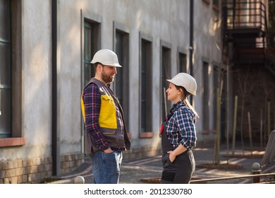 Woman And Man, Factory Employees Chatting During Lunch Break