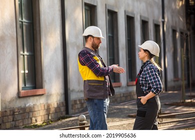 Woman And Man, Factory Employees Chatting During Lunch Break