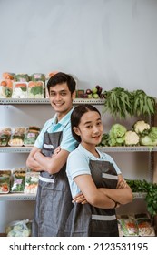 Woman And Man Greengrocer Standing Folded Hands