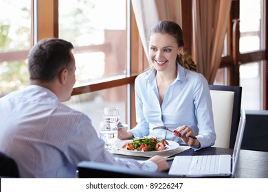 A Woman And A Man On A Business Lunch In A Restaurant