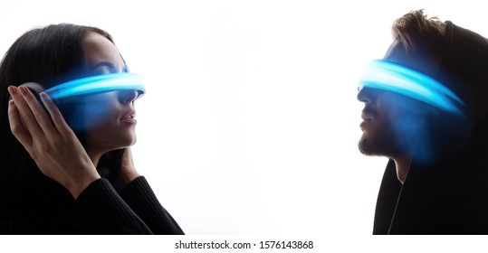 Woman and man portrait in VR helmet. Digital art. Male and female in glasses of virtual reality. Augmented reality, dream, future technology, game concept. Blue neon light. White background. - Powered by Shutterstock