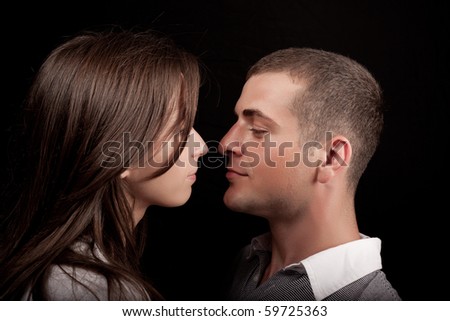 Similar – Man and woman face each other