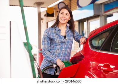 Woman Man Refuelling A Car At A Petrol Station