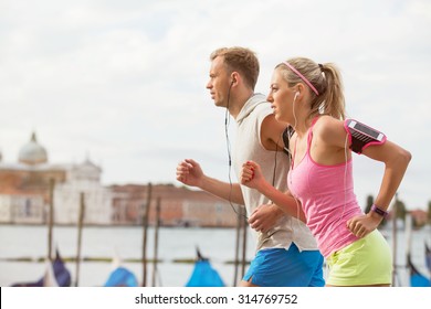 Woman And Man Running Outdoors Together