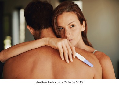 Woman, man and sad with hug for pregnancy test in bedroom, thinking and worry with anxiety in home. Couple, infertility and embrace for support, empathy and care for results in morning in apartment - Powered by Shutterstock