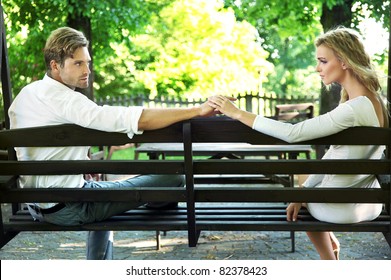 Woman and man sitting on bench