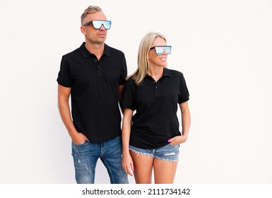 Woman And Man Wearing Black Polo Shirts, Mockup For Custom Poloshirt Designs