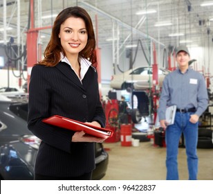 Woman Manager In Auto Repair Service. Garage.