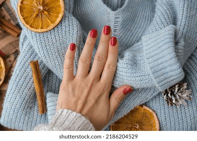 Woman manicured hands, stylish red nails, copy space. Blue sweater Closeup. Winter or autumn style of nail design concept. Beauty treatment. Fall nails - Shutterstock ID 2186204529