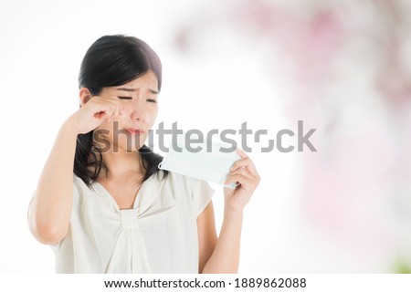 Woman with mask against white and pink background
