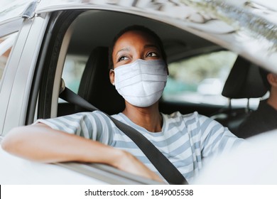 Woman With Mask At Drive Thru With Her Car