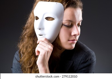 Woman With Mask In Hypocrisy Concept