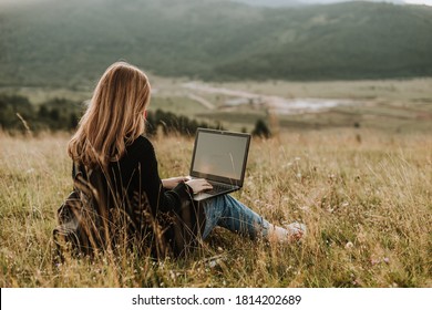 Woman With Mask Working On Laptop, Remote Location In Nature