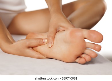 Woman Massaging Her Tired Feet