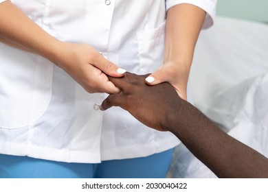 Woman Masseuse Doing Hand And Palm Massage To Black Man 