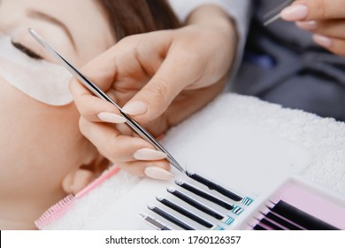 Woman Master Making Fake Long Lash Eyelash Extension Procedure.